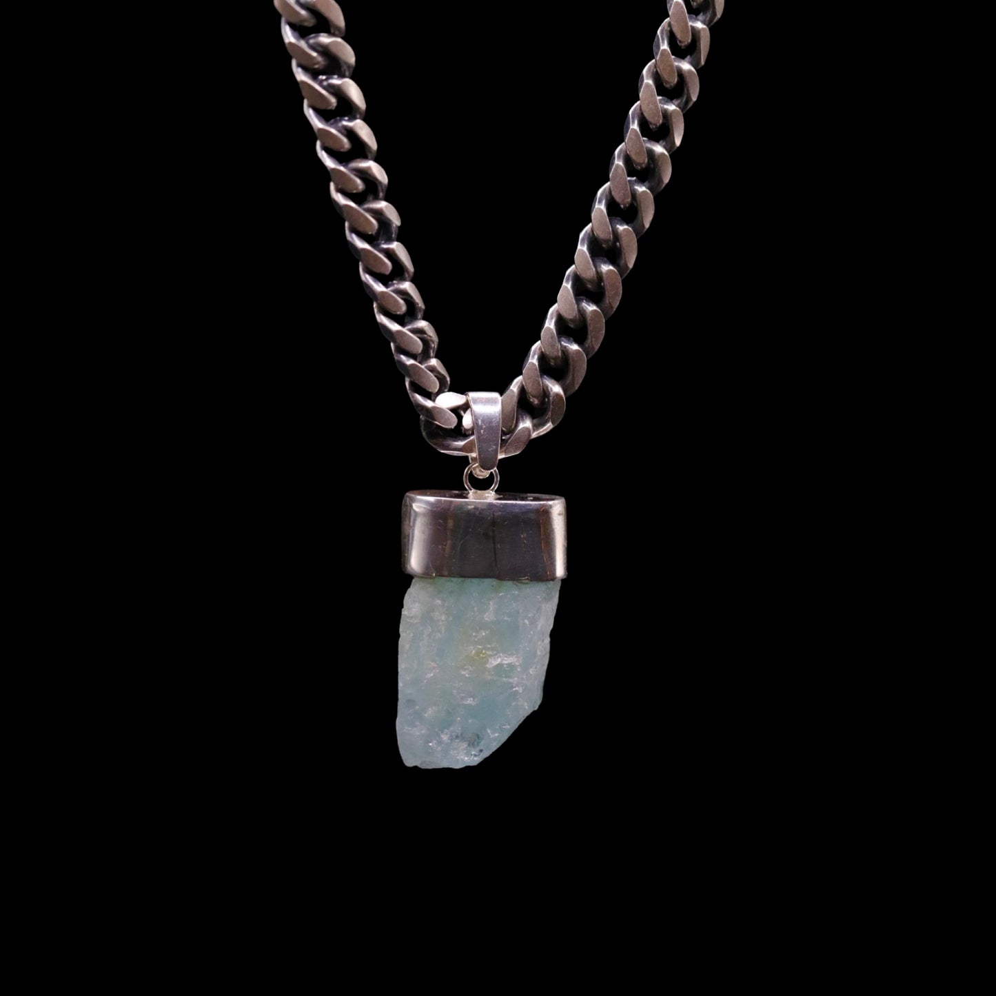 Natural Aquamarine on Gunmetal Curb