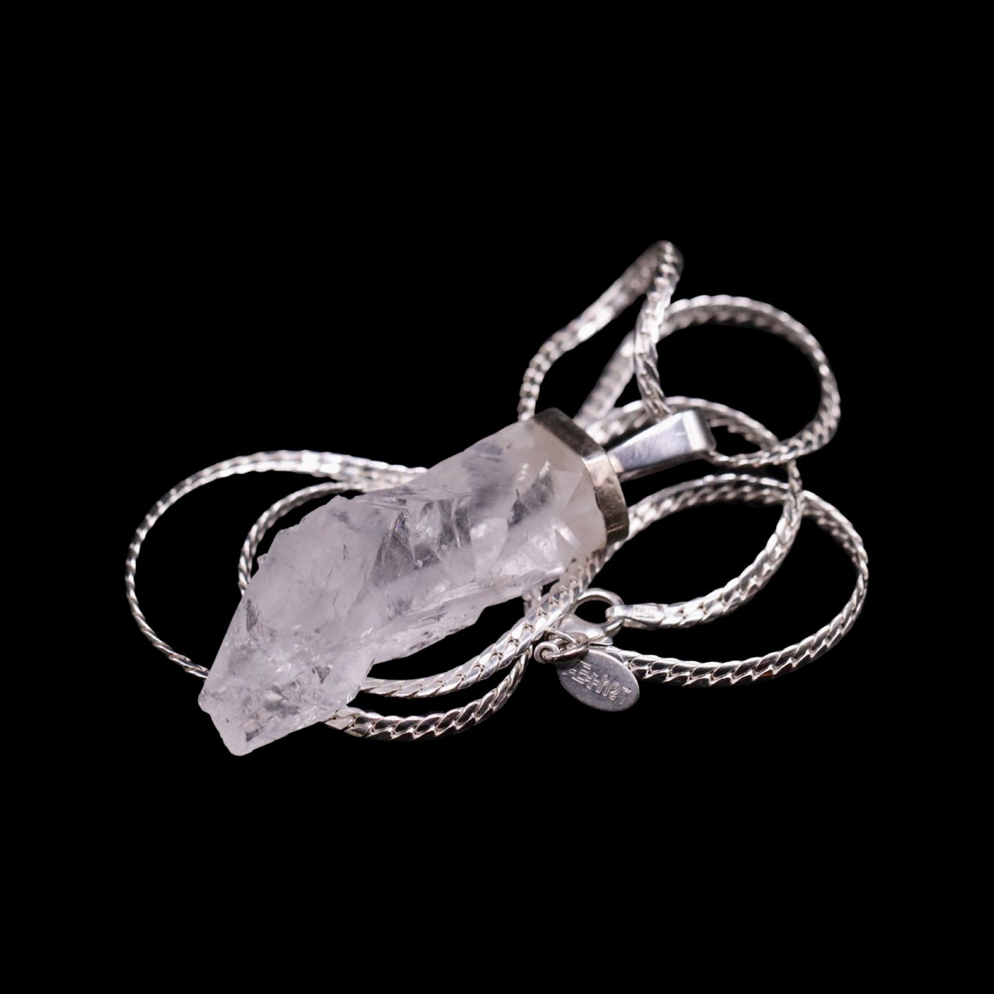 Raw Clear Quartz Point on Beveled Curb