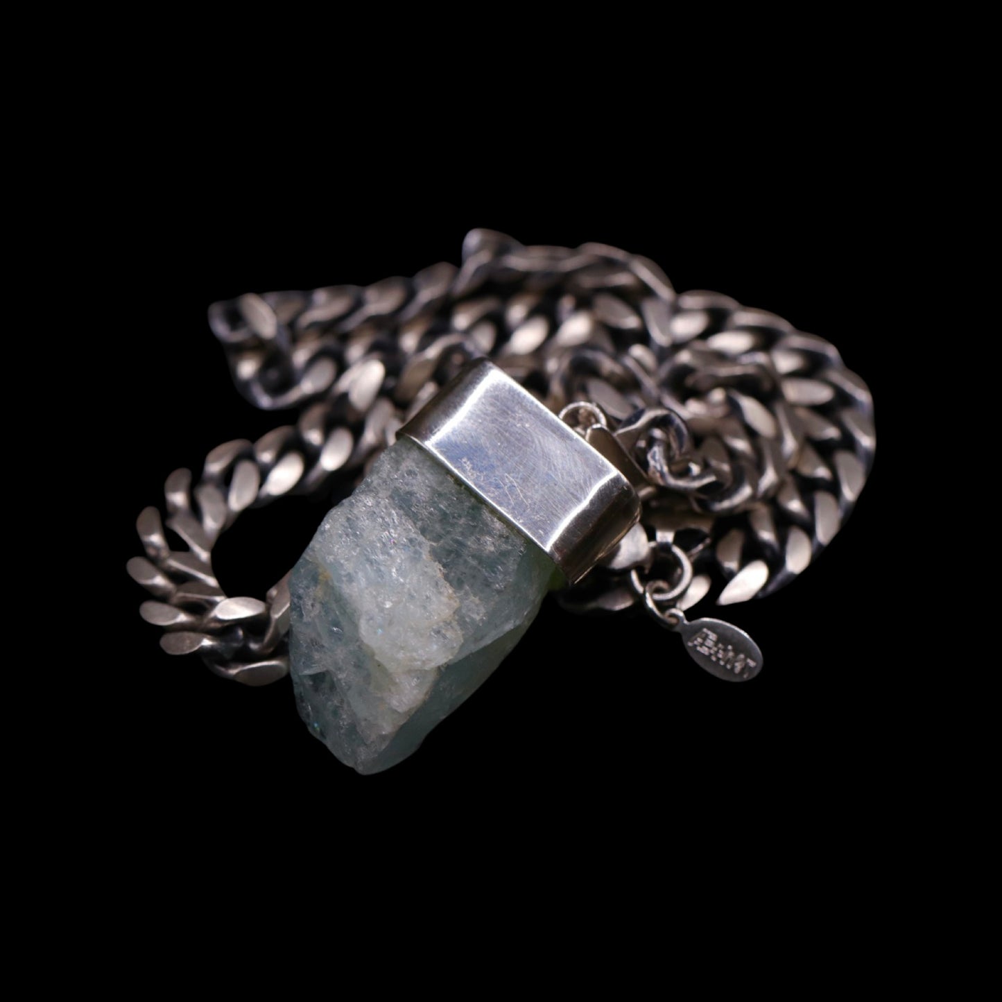 Natural Aquamarine on Gunmetal Curb